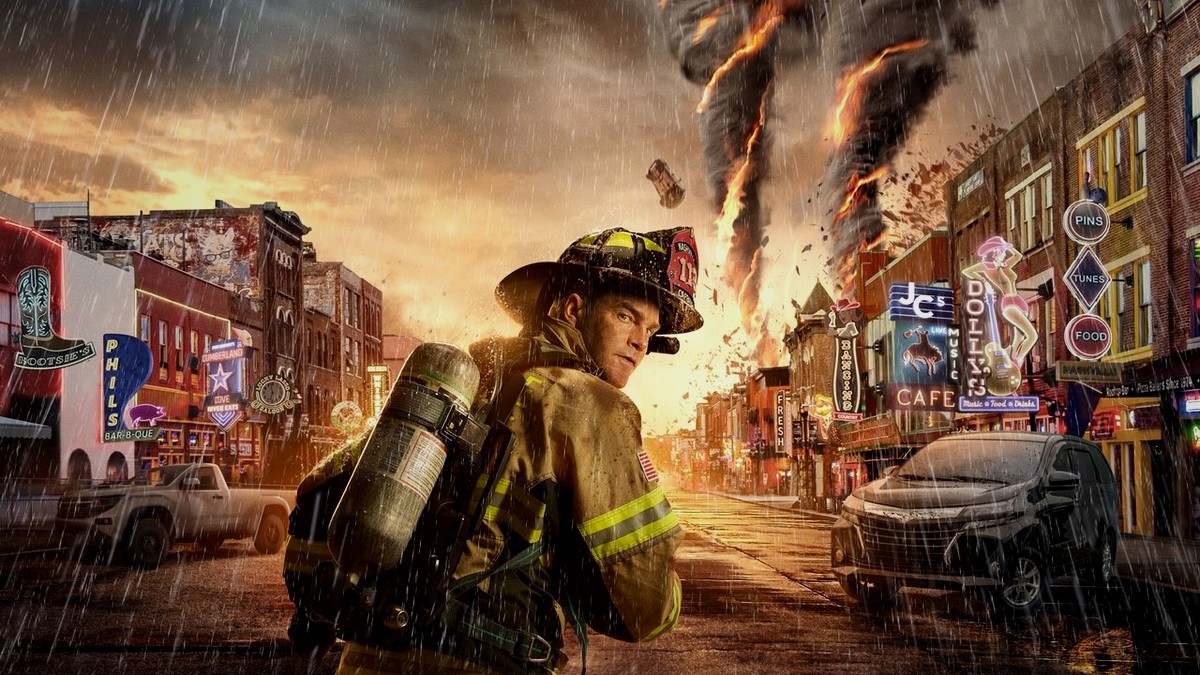 A firefighter in full gear walks Nashville's Broadway as a tornado tears through the strip.